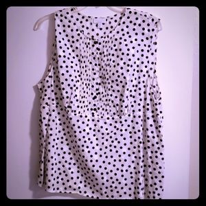 White and black polka dot sleeveless shirt
